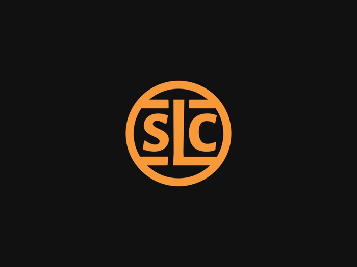 The SLC monogram in orange, locked inside a circle, on black